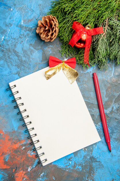 Top view empty open notepad with red pencil