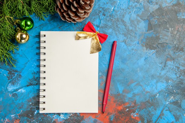 Top view empty open notepad with red pencil