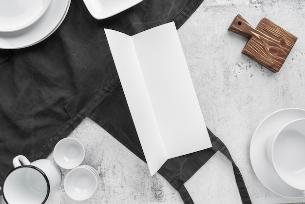 Top view of empty paper with cups and plates