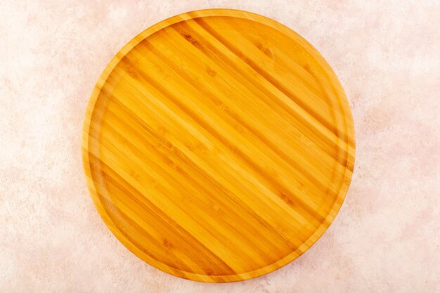 A top view empty wooden desk brown isolated on the pink background wood tree table