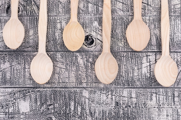 Top view empty wooden spoons on wooden