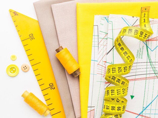 top view of fabrics with measuring tape and thread