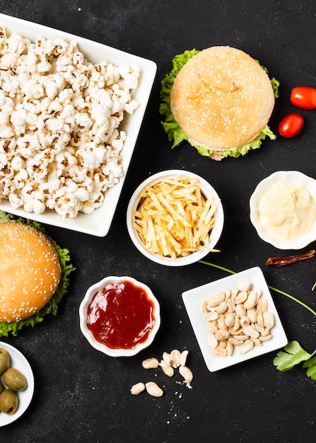 Top view of fast food on black table