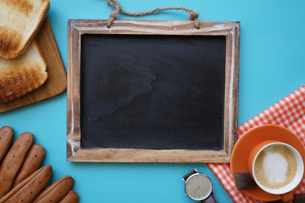 Top view of father's day composition with blank blackboard