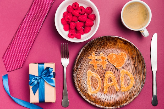 Top view father's day concept with dessert and gift