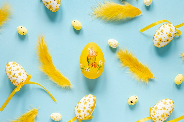 Top view feathers and eggs on table