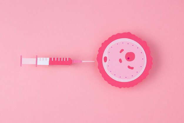 Top view fertility concept with pink background