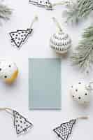 Free photo top view festive christmas ornaments arrangement with card