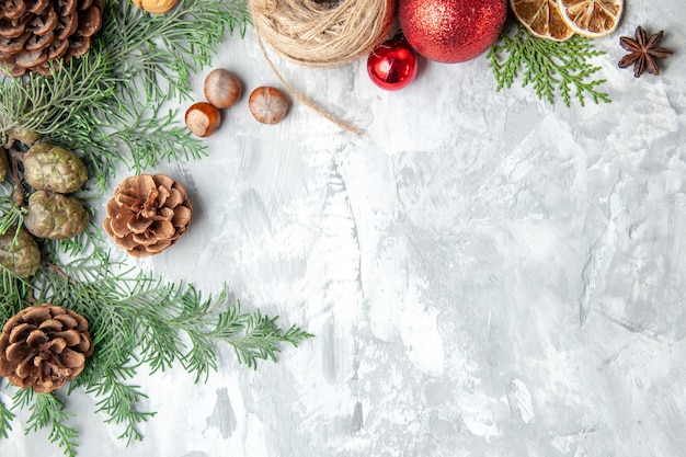 Top view fir tree branches cones on grey background