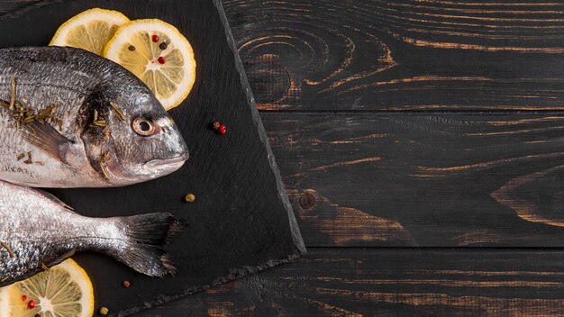 Top view fish and slices of lemon