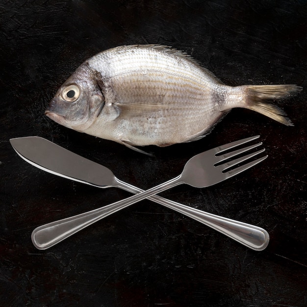 Top view of fish with cutlery