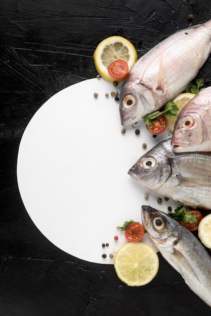 Top view of fish with plate and lemon