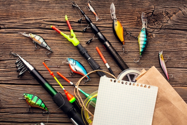 Top view of fishing essentials with paper bag and sheet of paper