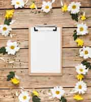 Free photo top view of floral concept on wooden table