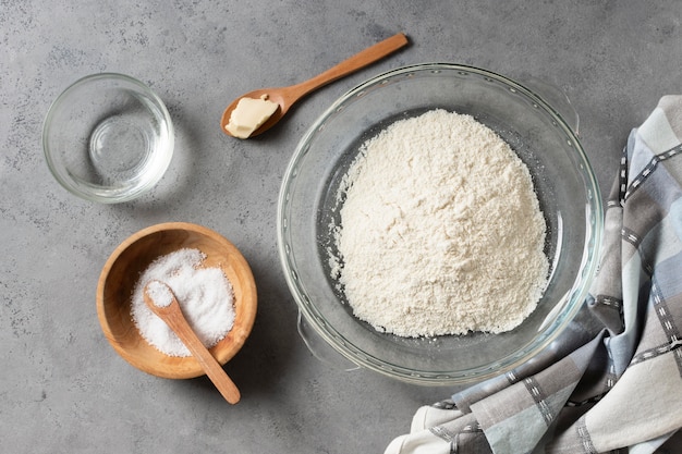 Top view flour and salt in bowl