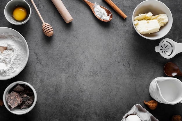 Top view flour with baking tools on the table