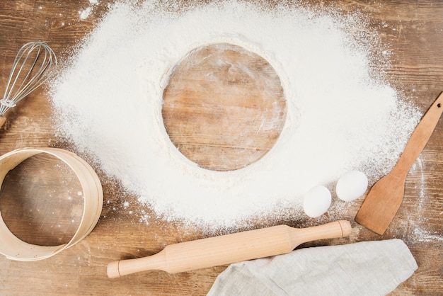 Top view of flour on wooden surface