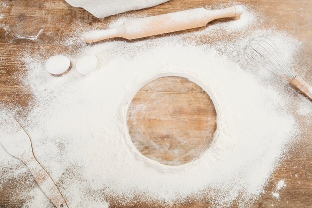 Top view of flour on wooden surface