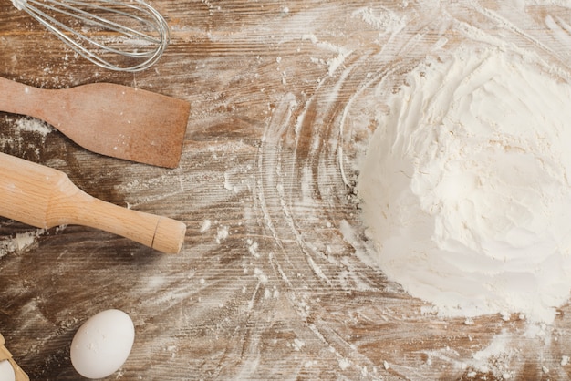 Top view of flour on wooden surface