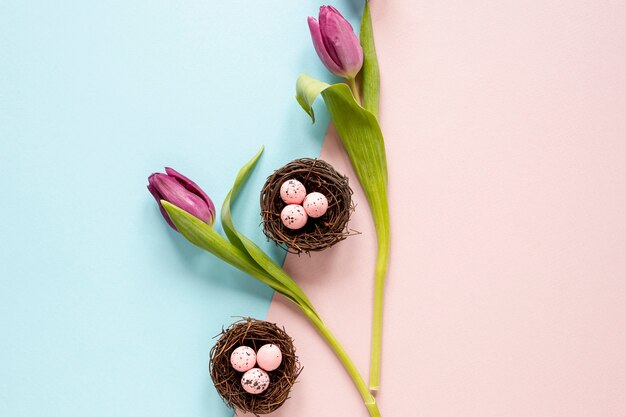 Top view flowers and baskets with eggs