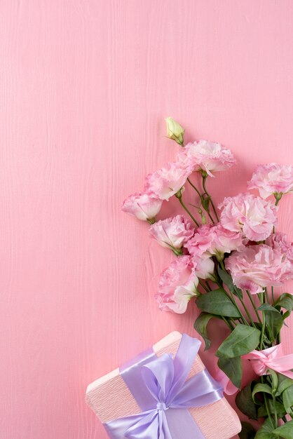 Top view of flowers bouquet with gift