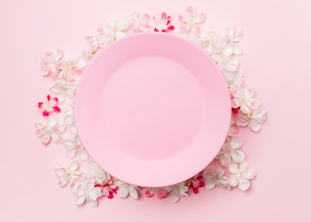 Top view flowers and pink plate