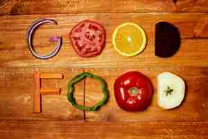 Free photo top view food arrangement on wooden background