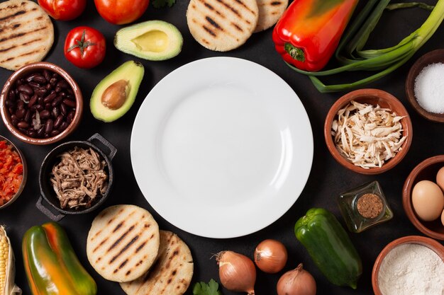 Top view food assortment with plate