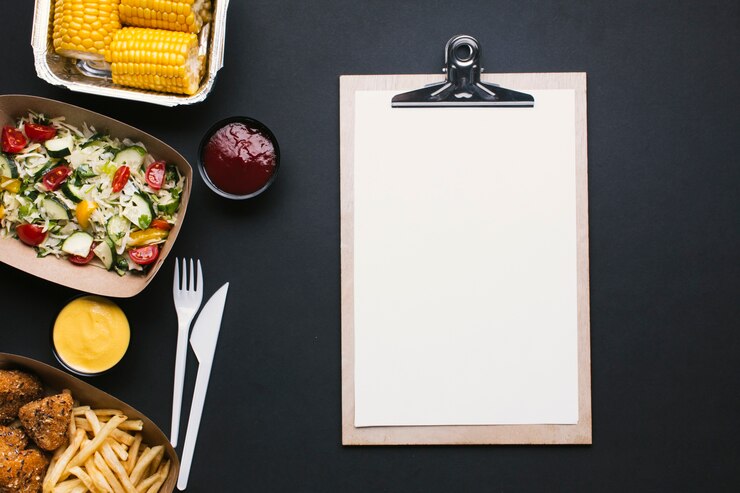 Free Photo top view food frame with clipboard