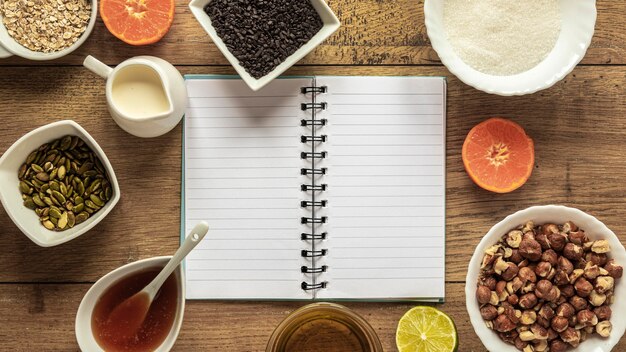 Top view of food ingredients with notebook