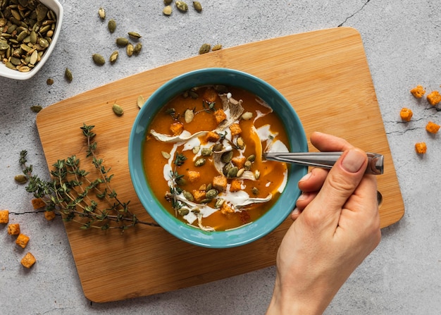 Top view of food ingredients with vegetable soup in bowl