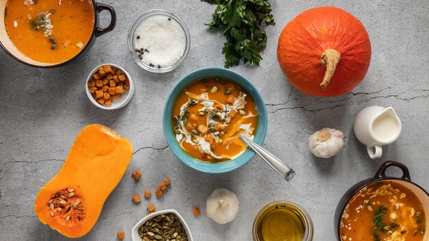 Top view of food ingredients with veggies and soup bowl