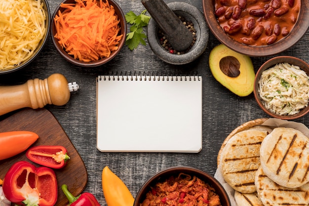 Top view food and notebook arrangement