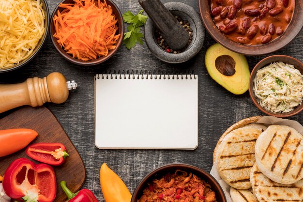 Top view food and notebook arrangement