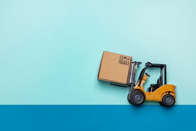 Top view forklift on blue background