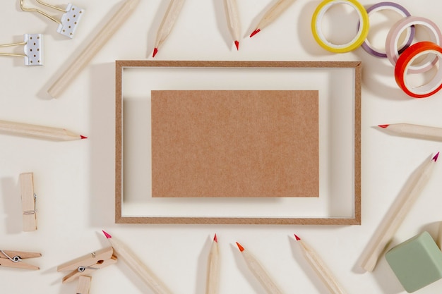 Top view frame surrounded by pencils