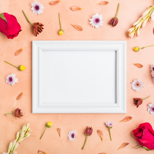 Top view of frame with assortment of spring flowers and roses