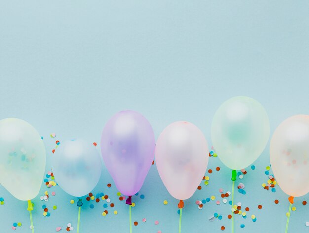 Top view frame with balloons and confetti