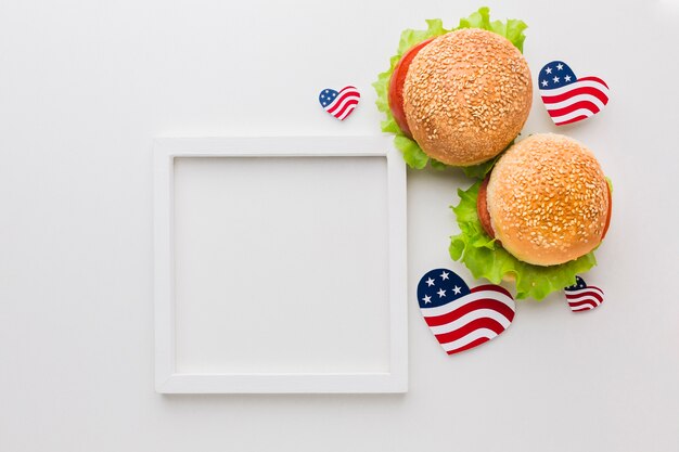 Top view of frame with burgers and american flags