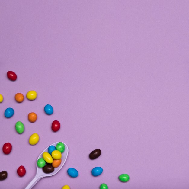 Top view frame with candy and spoon