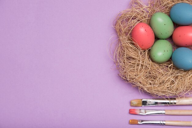 Top view frame with colored eggs and copy-space