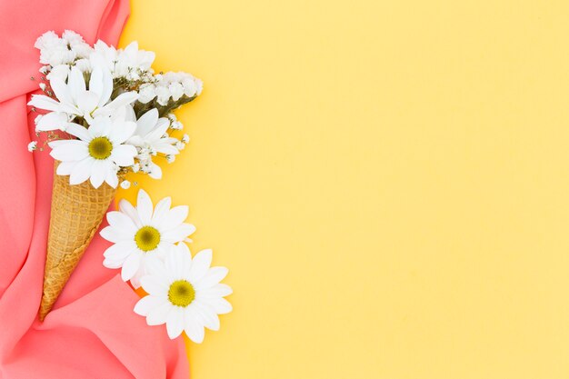 Top view frame with daisies and scarf