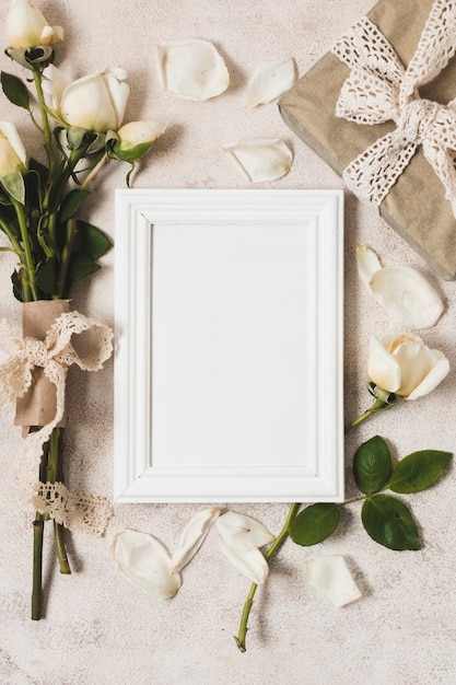 Top view of frame with gift and rose bouquet