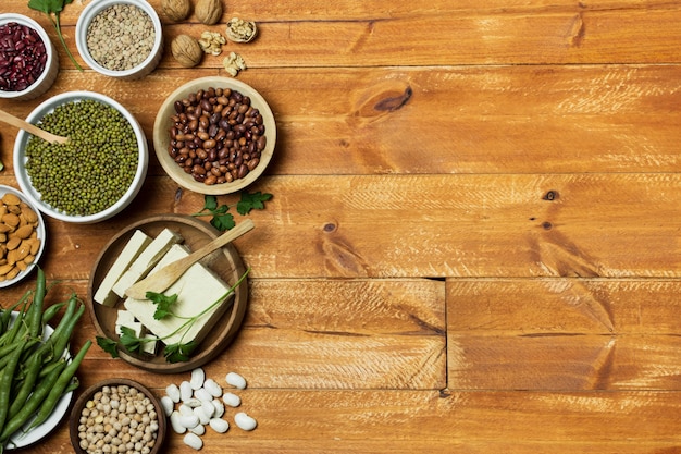 Top view frame with grains on wooden background