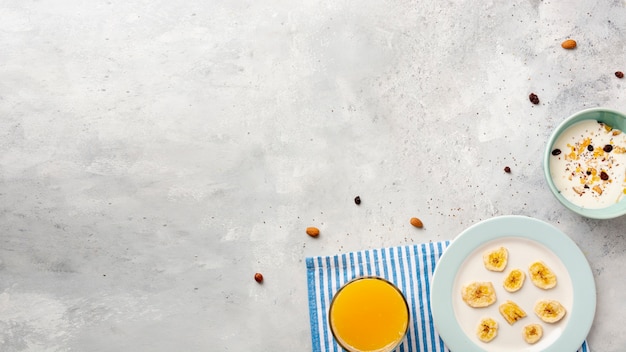 Top view frame with milk and cereals on stucco background