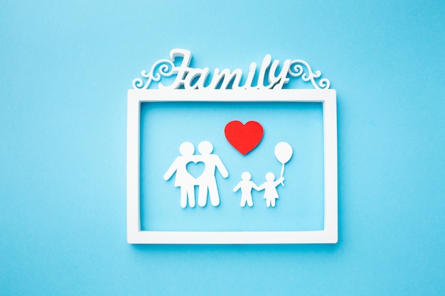 Free photo top view frame with paper family concept