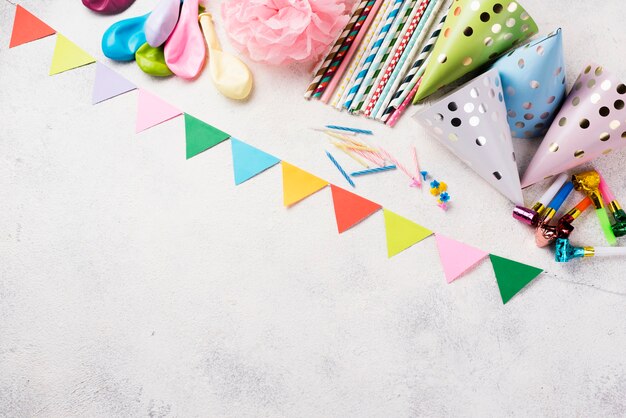 Top view frame with party hats and decorations