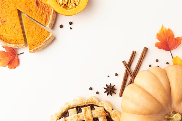 Top view frame with pumpkin and sliced pie