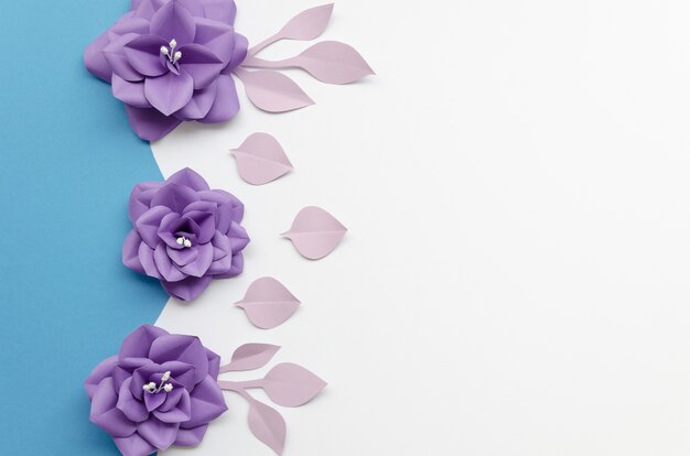 Top view frame with purple flowers and white background