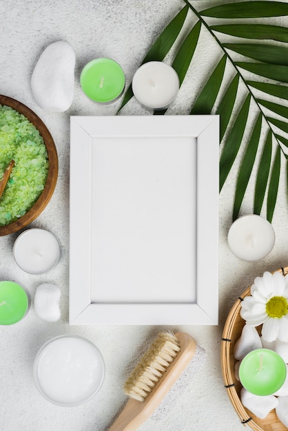 Top view frame with spa brush and candles